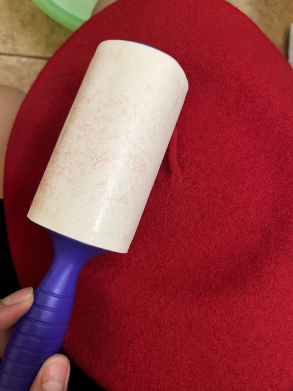 Lint roller on red hat